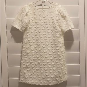 White shift dress with a twist.